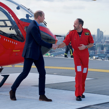 Prince William shakes hands with London's Air Ambulance pilot, Neil Jeffers