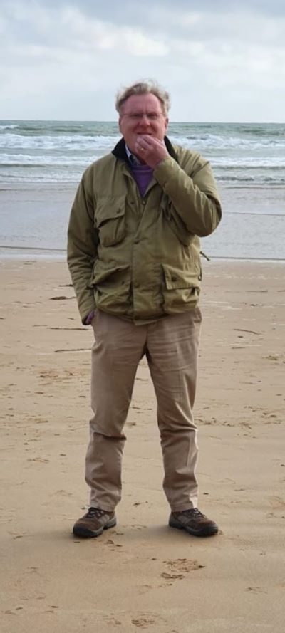 Mark Smith on a beach