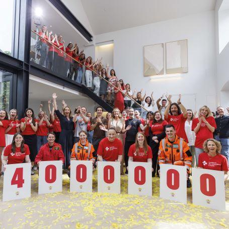 Charity staff announcing £4 million has been raised